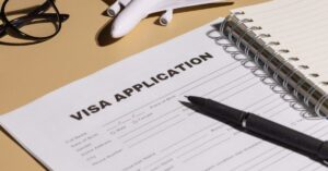 Visa application form and pen representing American immigration lawyers in Wenatchee