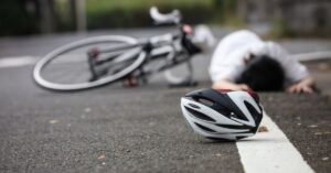 Injured cyclist on roadway after collision representing Moses Lake bicycle accident case