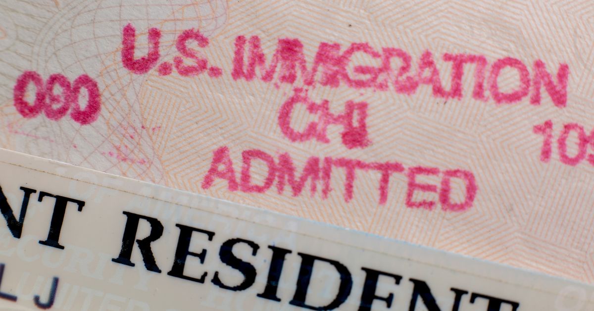 U.S. immigration stamp and resident card representing deportation defense case in Moses Lake