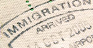 Immigration arrival stamp in passport representing lawful permanent residence process in Moses Lake