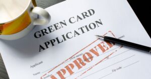 Green card application form marked approved representing Moses Lake LPR status legal services