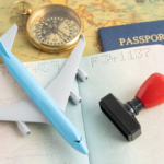 Passport, airplane model and entry stamp on a map