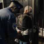 Person in detention behind bars