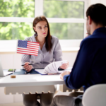 Attorney with an American flag meeting a client